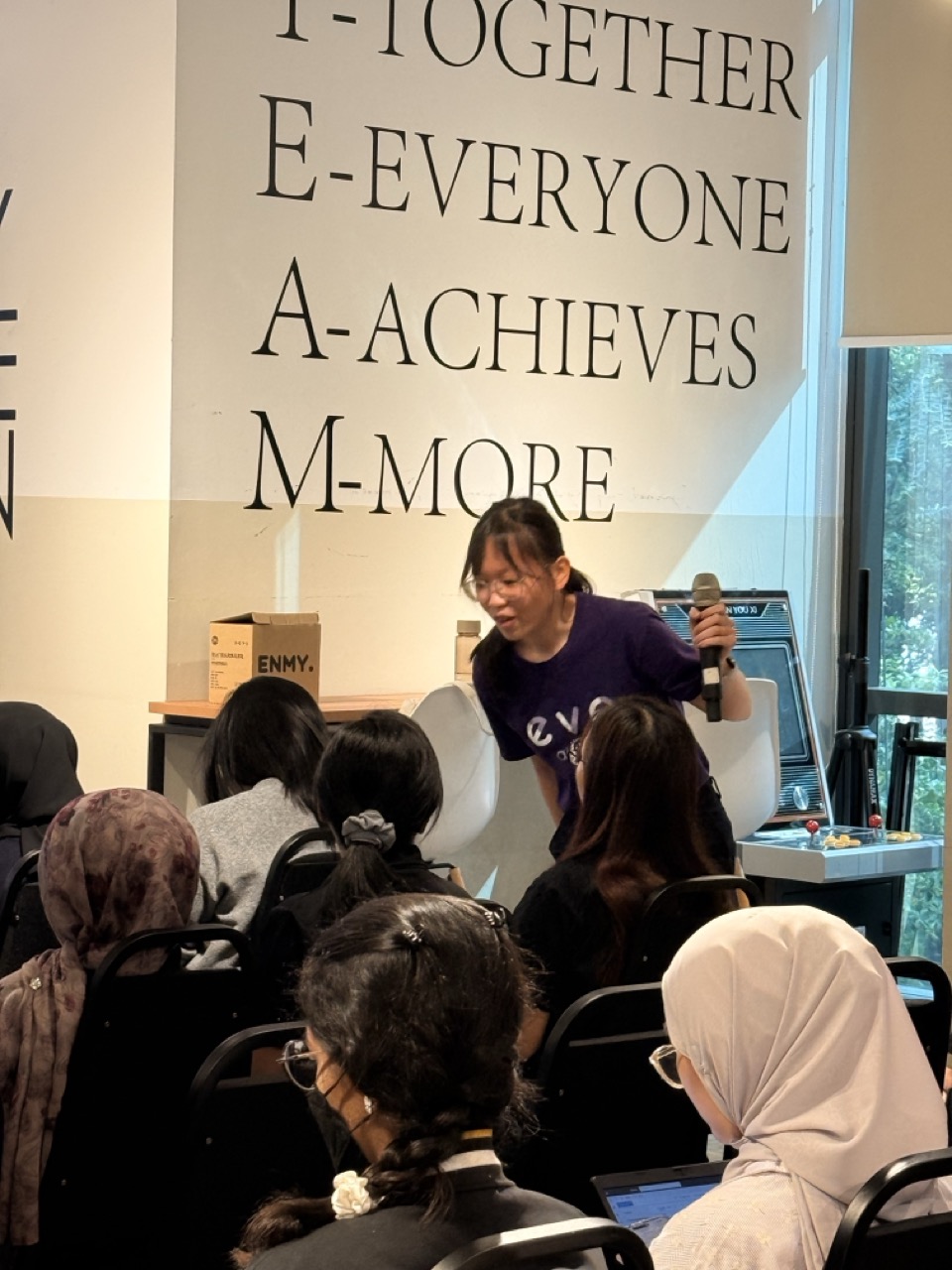 An eve & ai team member presenting a workplace wellbeing session to employees